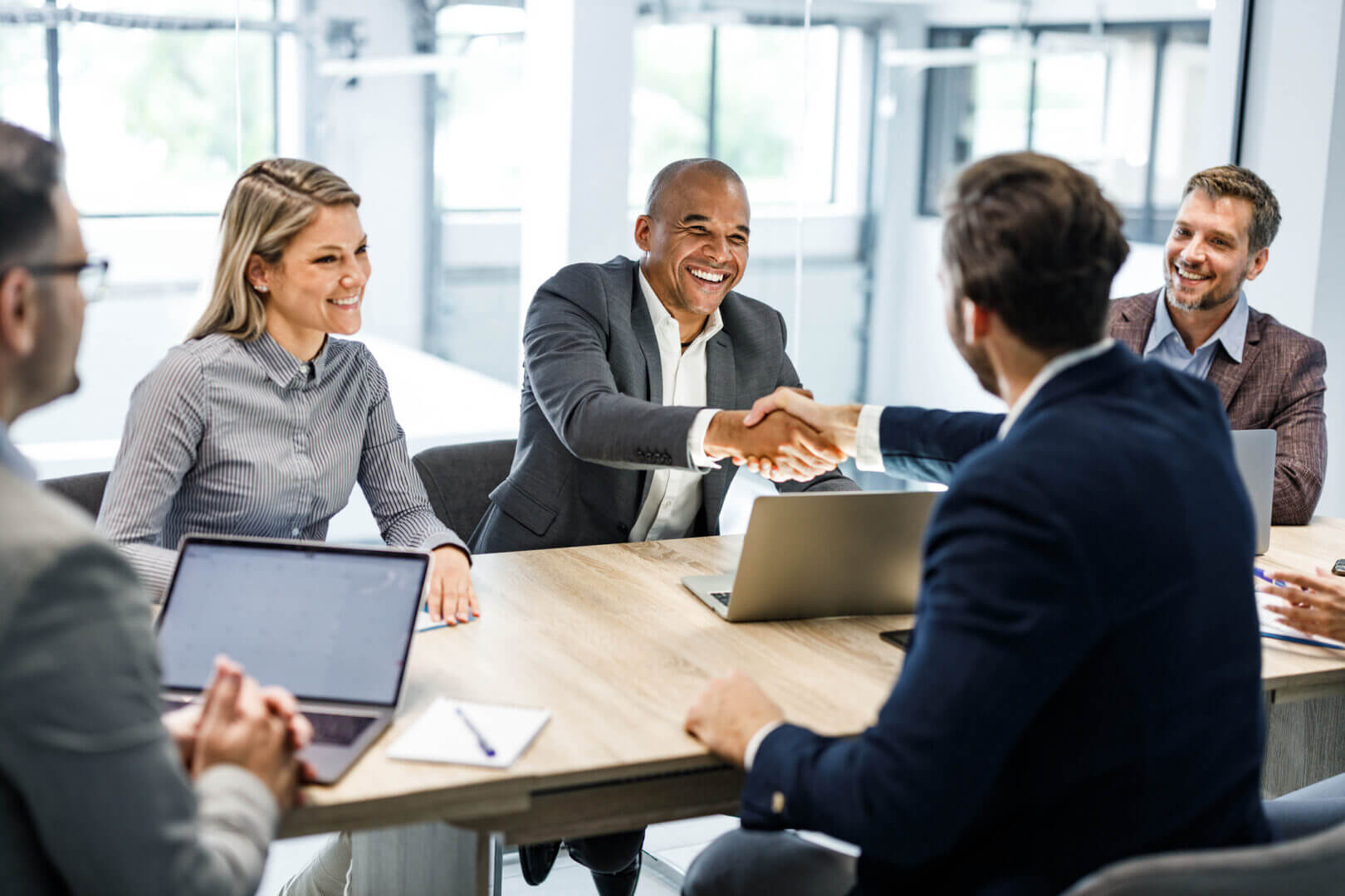 Handshake Over a Contract Agreement